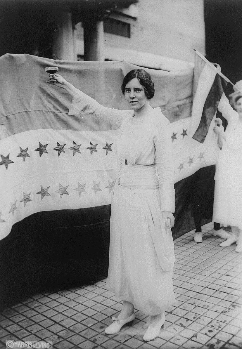 Alice Paul, toasting to the passage of the Nineteenth Amendment with grape juice