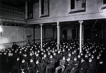 Patients at moving picture show wearing masks because of an influenza epidemic.